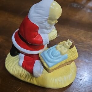 The Kneeling Santa With Baby Jesus